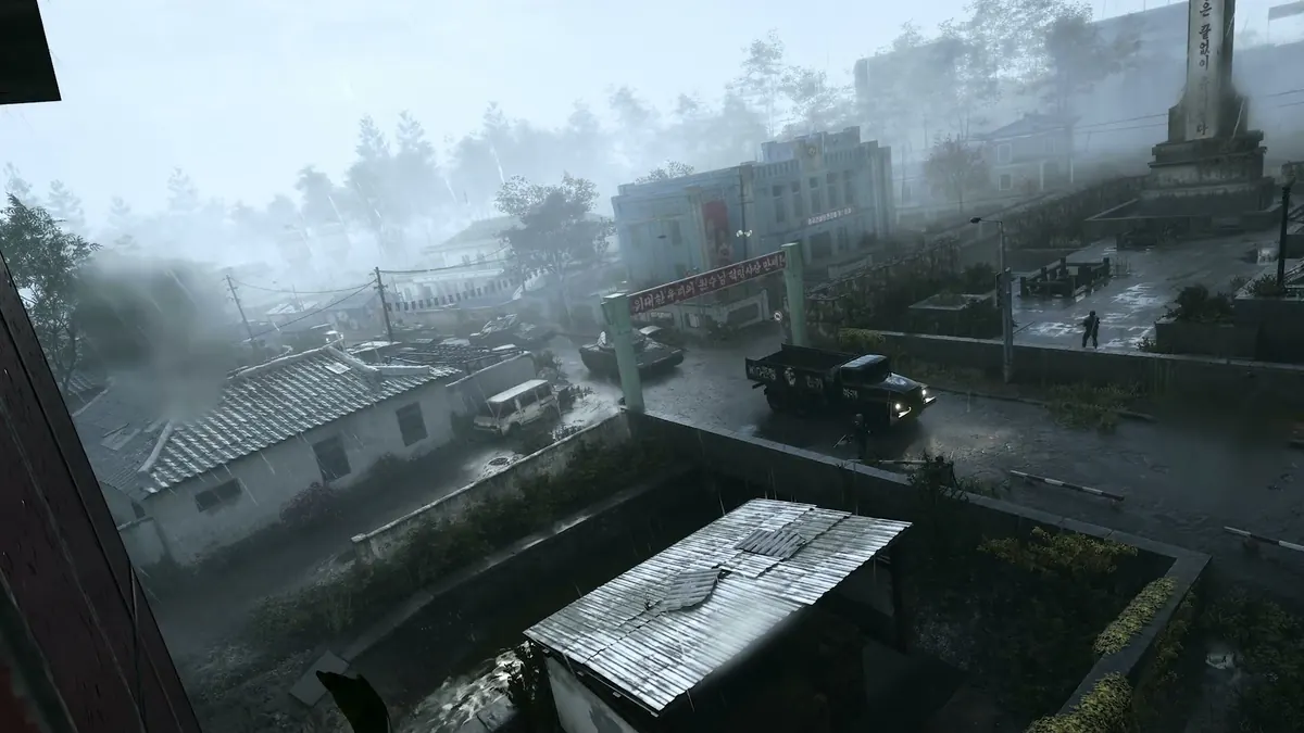 A Korean fishing village street with boats, market stalls and damaged buildings