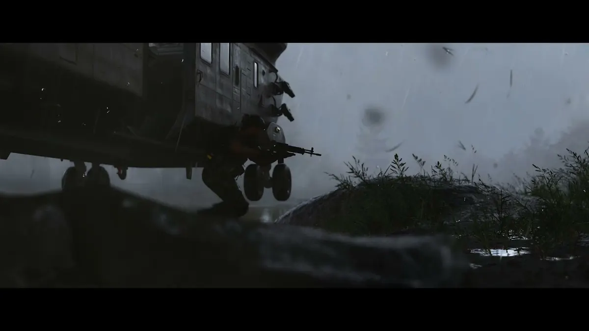 Three operators advancing down a war-damaged city street